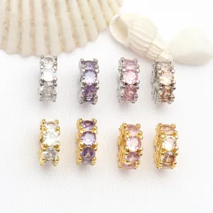 Detail view of round faceted cubic zirconia jewelry spacers in silver and gold plating