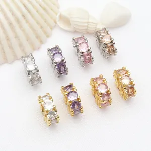 Macro detail of 18k gold plated spacer beads with sparkling round zirconia stones.