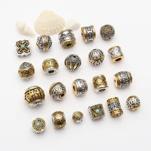 Tibetan style antique gold and silver alloy spacer beads with cloud and fret patterns