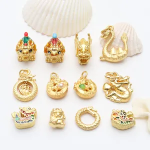 Variety of gold-plated dragon pendants with colorful enamel details for jewelry making.