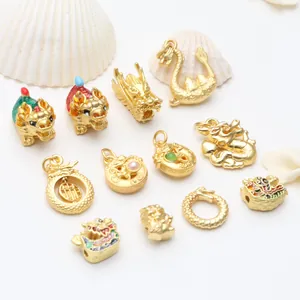 Detailed view of ancient gold dragon charms with colorful enamel and pearl accents