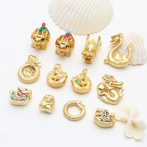 Close-up of various gold dragon charms with colorful enamel for dragon year bracelets