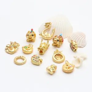 Close-up view of various ornate Chinese dragon charms with gold and enamel details