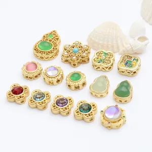 Detailed view of assorted gold-plated spacer beads with colorful stones and pearls