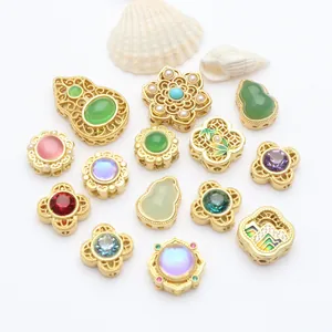 Detail view of exquisite gold-plated spacer beads with colorful stones and pearls.