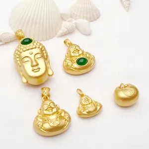 Collection of ancient gold-plated Buddha pendants featuring green gemstone inlays