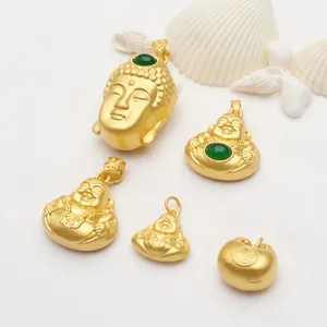 Detailed view of gold-plated Buddha pendants and Fu character charm for jewelry DIY