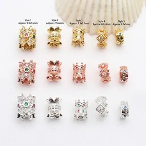 Detailed view of various micro-pave zircon spacer beads in gold, silver, and rose gold.