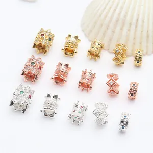 Close-up of micro-pave cubic zirconia spacer beads in gold, rose gold, and silver finishes