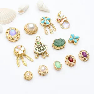Close-up detail of ancient gold enamel charms and beads for DIY jewelry necklace bracelets