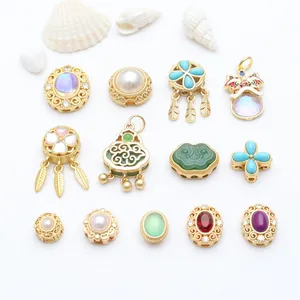 Macro view of antique gold-plated enamel beads and decorative charms for DIY jewelry craft