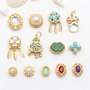 Collection of Chinese-style gold charms featuring colorful enamel and stone details.