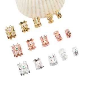Detailed variety of CZ-paved jewelry charms in gold, rose gold, and silver finishes.