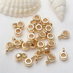 Detailed macro view of 18K gold plated circular pendant loops for DIY jewelry projects