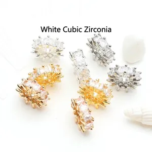 Macro detail of 14K gold plated wheel spacer beads with sparkling white zirconia stones