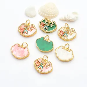 Detail of traditional Chinese Ruyi lock charms with intricate floral and magpie designs.