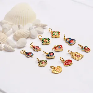 Macro view of assorted colorful enamel sand gold charms featuring traditional Chinese motifs