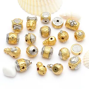 Detailansicht goldener und silberner buddhistischer Zwischenperlen für DIY-Schmuck