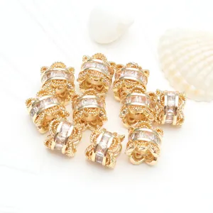 Detailed close-up of 14K gold-filled waist spacer beads with micro-set zircons for DIY jewelry