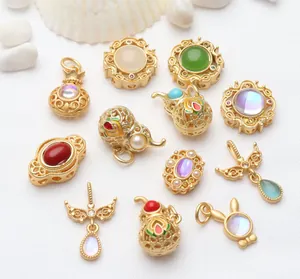 Detailed view of assorted ancient gold charms and enamel beads for DIY jewelry