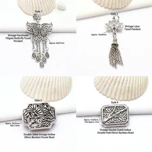 Sélection de quatre pendentifs vintage en alliage d'argent tibétain à motifs de papillons