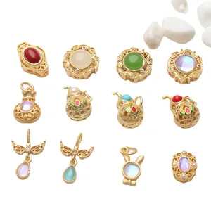 Variety of gold-plated DIY jewelry charms and enamel spacers for handmade bracelets