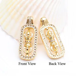 Close-up detail of 18K gold plated rotatable Vajra pendant showing front and back