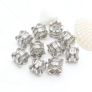 Detailed macro view of silver color micro-inlaid zircon barrel spacer beads for DIY bracelet