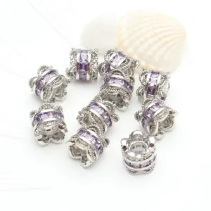 Macro detail of silver plated spacer beads with micro-set purple zircons