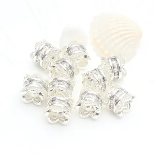 Close-up detail of silver-colored spacer beads with micro-set cubic zirconia stones