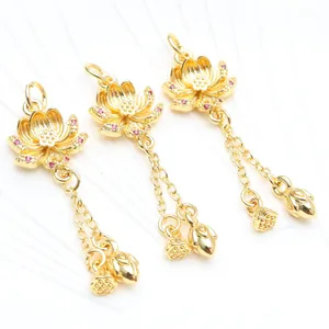 Detailed view of 18K gold plated lotus charms with sparkling zircon and dangling chain