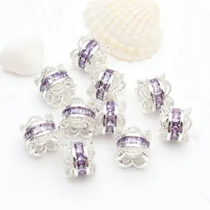 Detail of silver hollow beads with purple zircons for jewelry DIY crafting