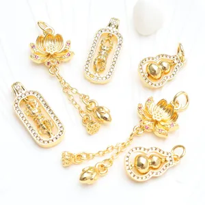 Detailed view of 18K gold-plated pendants with micro-pave zircons and spinning lotus