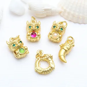 Detailed close-up view of ancient gold Chinese zodiac dragon charms for DIY jewelry