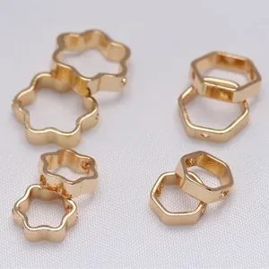 Macro detail of 14K gold plated flower and hexagon spacer beads for jewelry making