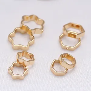 Macro view of 14K gold-plated flower and hexagonal beads with side threading holes