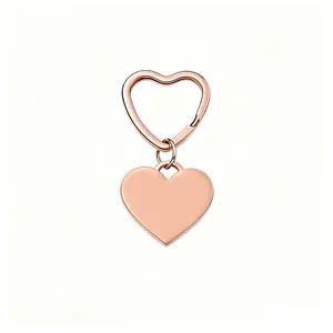 Close-up of rose gold heart-shaped stainless steel keychain with polished finish