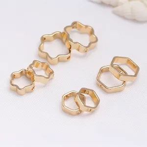 Macro detail of 14K gold filled flower and hexagon shaped DIY jewelry spacer beads