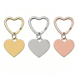 Three stainless steel heart-shaped keychains in gold, silver, and rose gold finishes