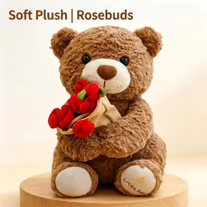 Detailed shot of a brown plush teddy bear holding red roses on a round wooden base.