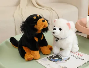 Detailed view of realistic Tibetan Mastiff and Pomeranian plush dog toys on a table