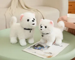 Pair of realistic white Pomeranian plush toys with black collars on a round table