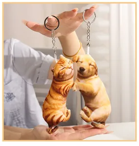 Detailed macro shot of realistic plush cat and dog animal keychains held in hands
