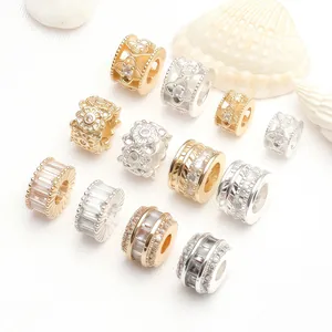 Detailed display of 14K gold-plated and silver beads with micro-pave cubic zirconia.