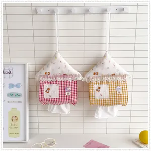 Pair of cute house-shaped hanging tissue holders in pink and yellow gingham fabric.