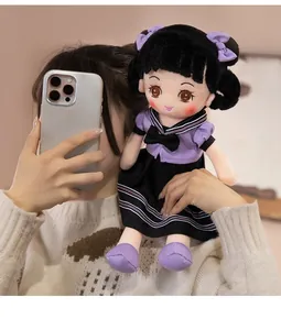 Cute college style plush girl doll held by a person, showing soft fabric details