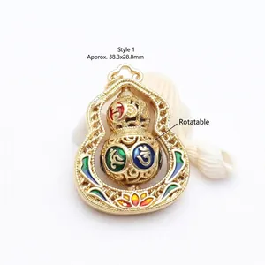Close-up of rotatable golden hulu pendant featuring colorful Six-Syllable Mantra enamel