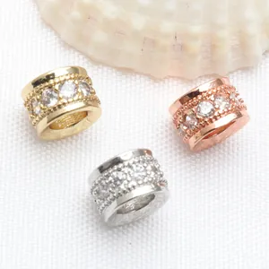 Close-up view of gold, rose gold, and silver micro-set zircon spacer beads for DIY jewelry