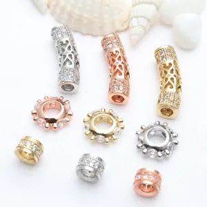 Detail of DIY jewelry accessories including micro-pave CZ hollow curved tubes and spacer beads.