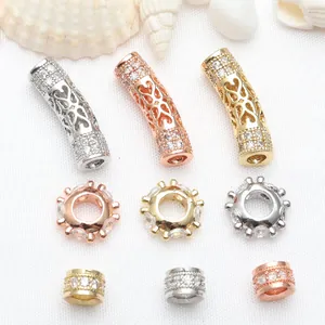 Detailed macro view of CZ micro-pave hollow tube beads and spacers in three metal tones
